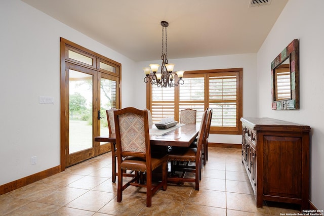 137A Spanish Pass, Boerne, TX 78006 - dining room featuring baseboards, healthy amount of natural light, and a chandelier