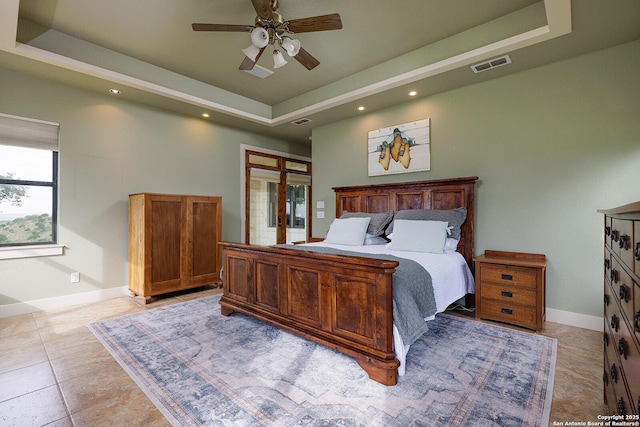 137A Spanish Pass, Boerne, TX 78006 - bedroom with a tray ceiling, baseboards, french doors, recessed lighting, and light tile patterned floors