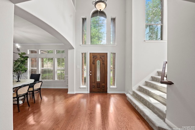 8715 Anton Chico, Helotes, TX 78023 - entryway with arched walkways, wood finished floors, and a healthy amount of sunlight