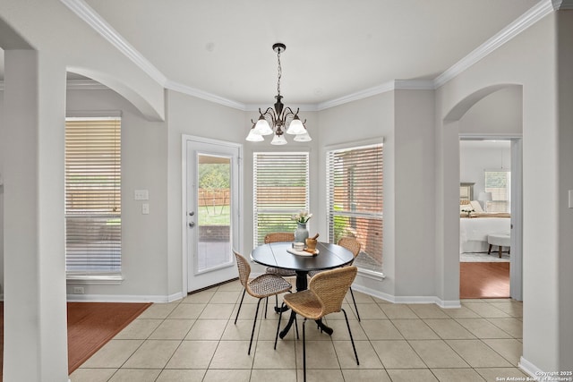 8715 Anton Chico, Helotes, TX 78023 - dining area featuring light tile patterned floors, arched walkways, ornamental molding, and baseboards