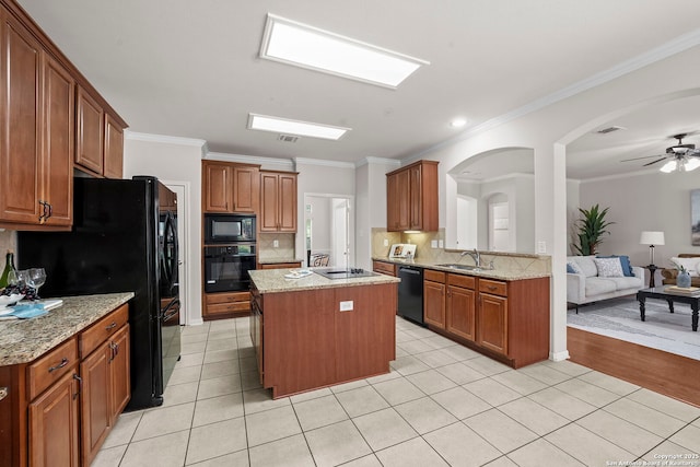 8715 Anton Chico, Helotes, TX 78023 - kitchen with a sink, backsplash, a kitchen island, ornamental molding, and black appliances