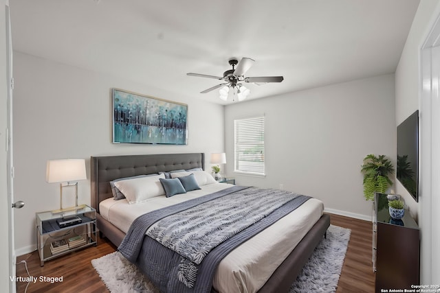 8715 Anton Chico, Helotes, TX 78023 - bedroom with baseboards, ceiling fan, and dark wood-style floors