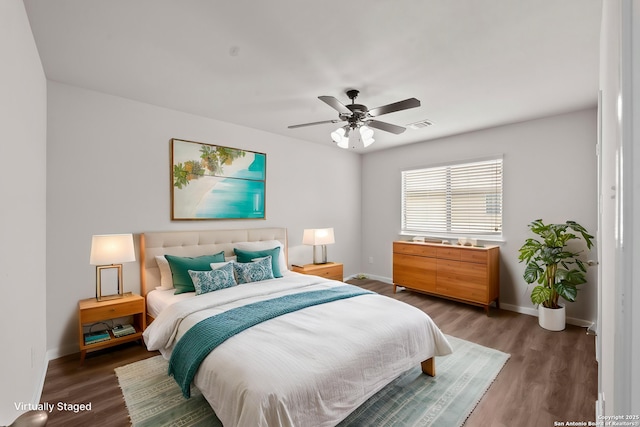 8715 Anton Chico, Helotes, TX 78023 - bedroom with baseboards, ceiling fan, wood finished floors, and visible vents