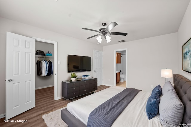 8715 Anton Chico, Helotes, TX 78023 - bedroom with visible vents, a closet, wood finished floors, baseboards, and a spacious closet