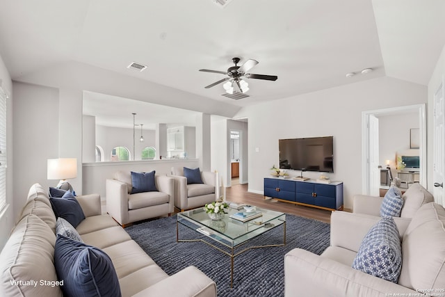 8715 Anton Chico, Helotes, TX 78023 - living area featuring a ceiling fan, lofted ceiling, wood finished floors, and visible vents