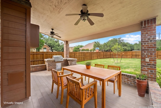 8715 Anton Chico, Helotes, TX 78023 - view of patio with outdoor dining area, a fenced backyard, area for grilling, an outdoor kitchen, and a ceiling fan