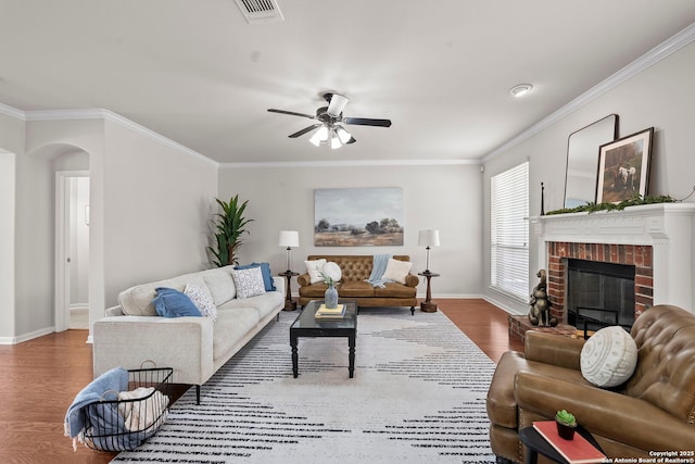 8715 Anton Chico, Helotes, TX 78023 - living room featuring arched walkways, baseboards, a ceiling fan, and wood finished floors