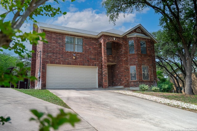 1903 Copperfield, San Antonio, TX 78251 - traditional-style house featuring concrete driveway, brick siding, and an attached garage