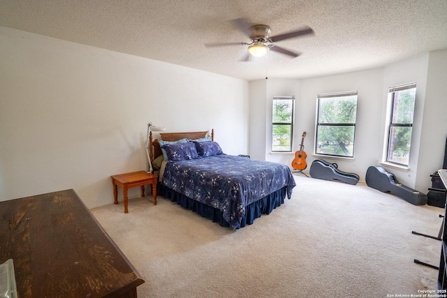 1903 Copperfield, San Antonio, TX 78251 - bedroom featuring a ceiling fan, a textured ceiling, and carpet