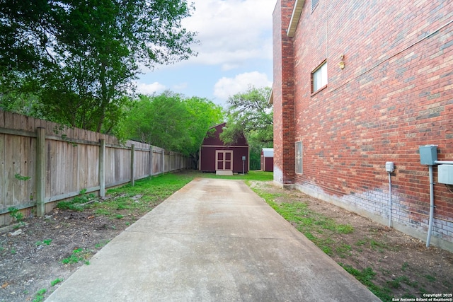 1903 Copperfield, San Antonio, TX 78251 - view of yard with an outbuilding, fence, and a storage shed