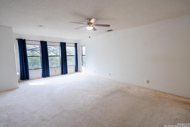 1903 Copperfield, San Antonio, TX 78251 - carpeted spare room featuring visible vents, a textured ceiling, and ceiling fan