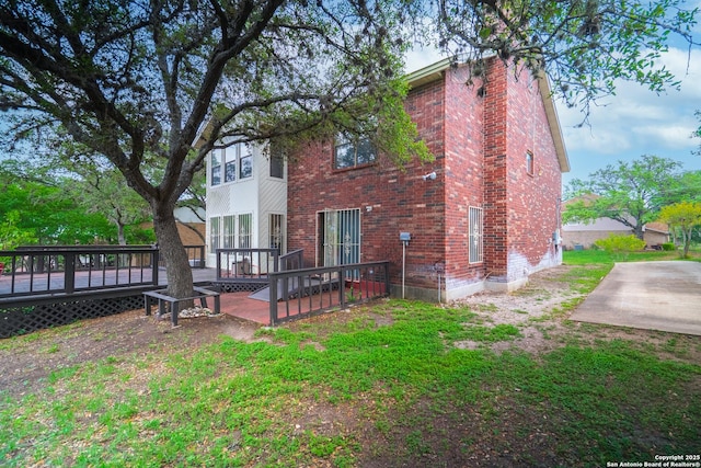 1903 Copperfield, San Antonio, TX 78251 - back of house featuring a chimney, a deck, and brick siding