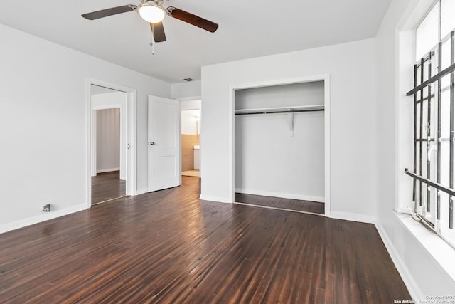 unfurnished bedroom with baseboards, ceiling fan, a closet, and wood finished floors