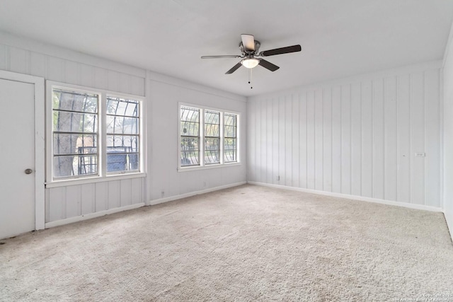 carpeted empty room with ceiling fan