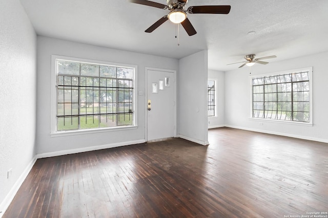 unfurnished living room with baseboards, ceiling fan, and hardwood / wood-style flooring