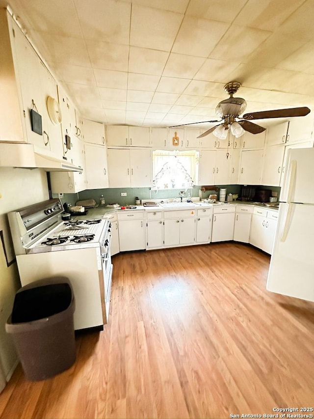 kitchen featuring white cabinets, ceiling fan, white appliances, light wood-type flooring, and under cabinet range hood