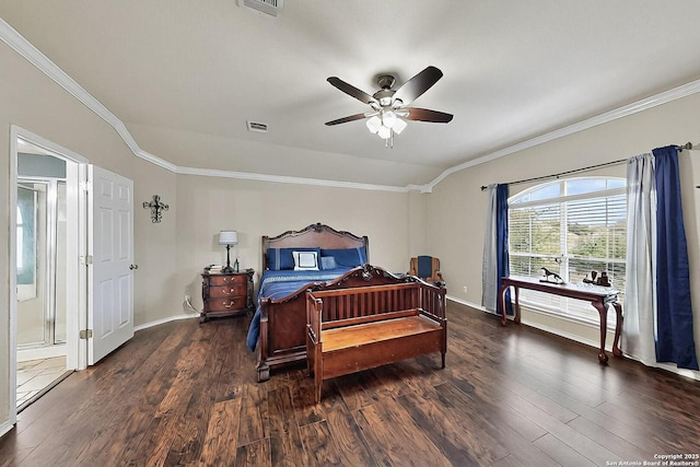 bedroom with crown molding, baseboards, and wood finished floors