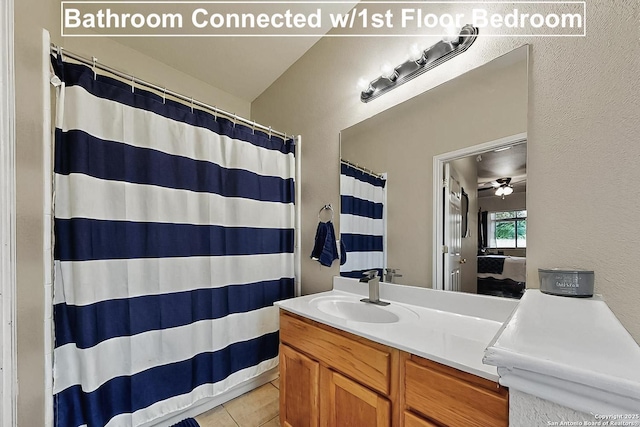 bathroom featuring vanity, a shower with curtain, and tile patterned floors