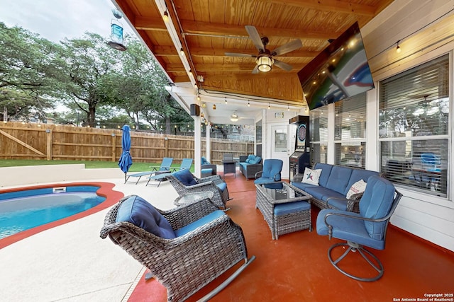 exterior space featuring fence, a fenced in pool, ceiling fan, and an outdoor living space