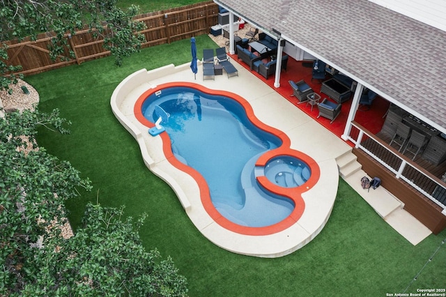 view of pool with a patio area, a fenced in pool, a fenced backyard, an outdoor hangout area, and a yard