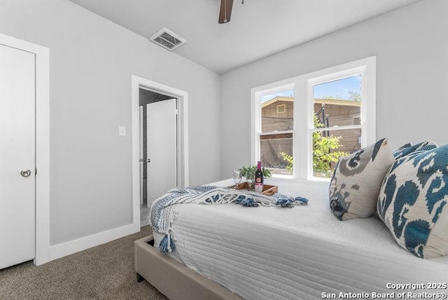 carpeted bedroom featuring vaulted ceiling, baseboards, a ceiling fan, and visible vents