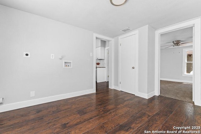 unfurnished room with baseboards, a ceiling fan, wood finished floors, and visible vents