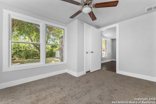 unfurnished bedroom featuring baseboards and visible vents