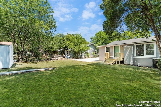 view of yard with a shed and an outbuilding