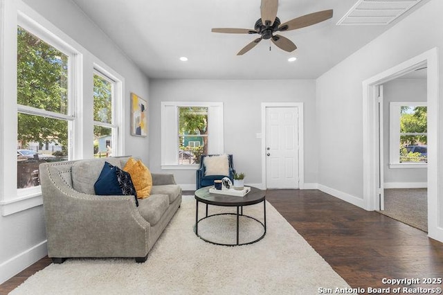 living area featuring visible vents, wood finished floors, baseboards, ceiling fan, and recessed lighting
