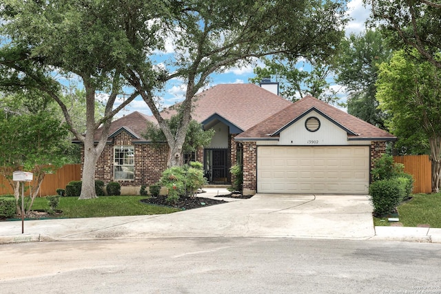 ranch-style house with a garage, fence, a chimney, a shingled roof, and concrete driveway