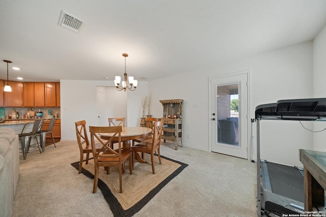 dining room featuring light colored carpet, a chandelier, recessed lighting, baseboards, and visible vents