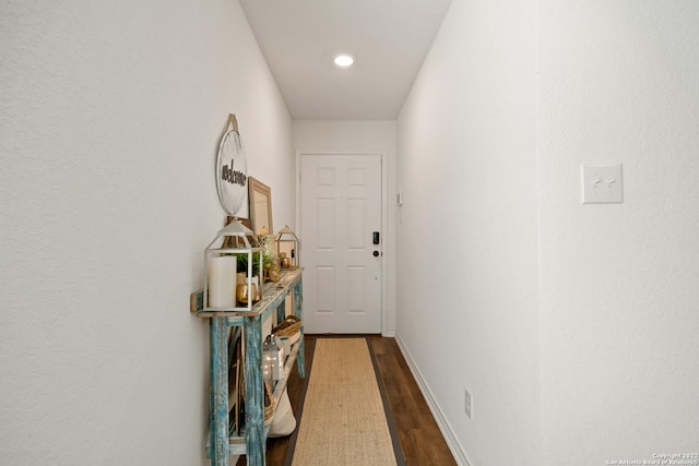 doorway to outside with recessed lighting, baseboards, and dark wood-style flooring