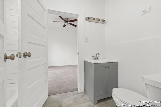 full bathroom with vanity, ceiling fan, and toilet