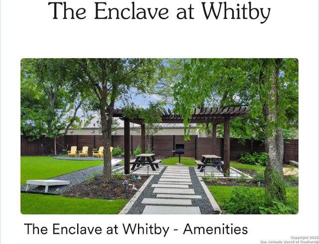 exterior space with fence and a pergola