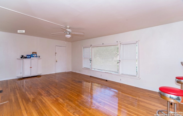 spare room with ceiling fan and hardwood / wood-style floors