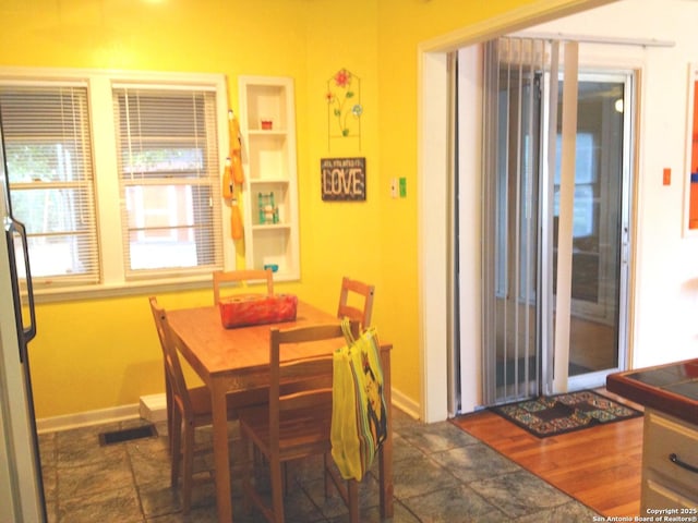 416 Alexander Hamilton, San Antonio, TX 78228 - dining area with baseboards and built in shelves