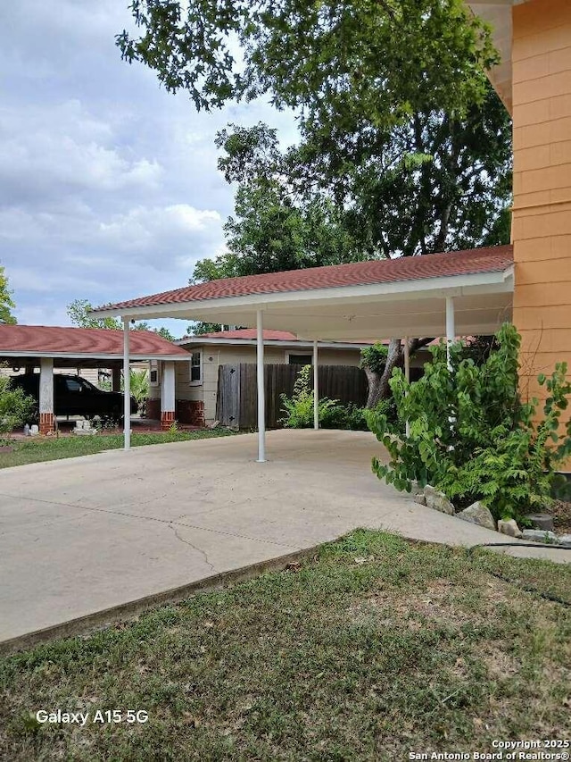 416 Alexander Hamilton, San Antonio, TX 78228 - view of parking with fence and a carport