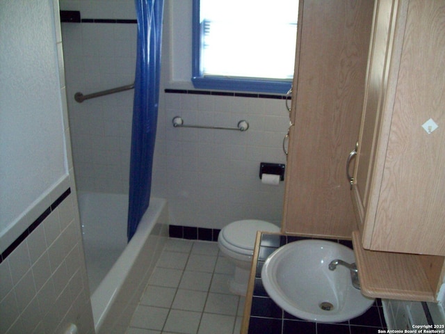 full bathroom with visible vents, tile walls, tile patterned flooring, curtained shower, and toilet