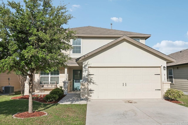 traditional-style home featuring a front lawn, a garage, stucco siding, concrete driveway, and central air condition unit