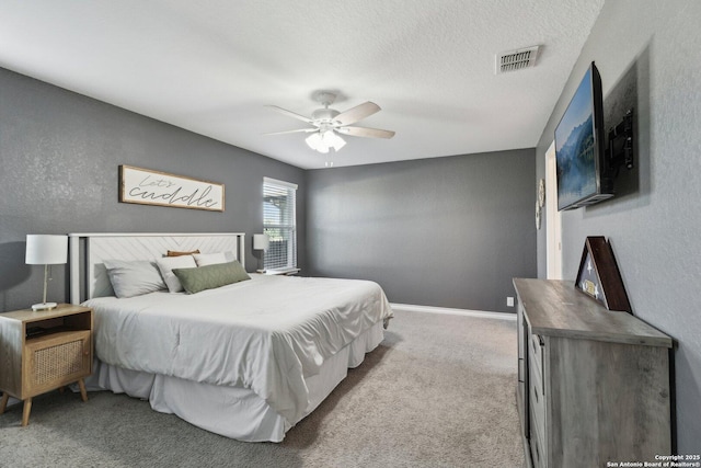 bedroom with visible vents, carpet, ceiling fan, and baseboards