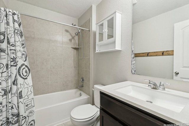 bathroom with vanity, toilet, and shower / tub combo