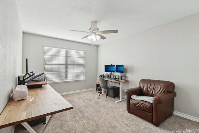 office space with baseboards, carpet flooring, and ceiling fan