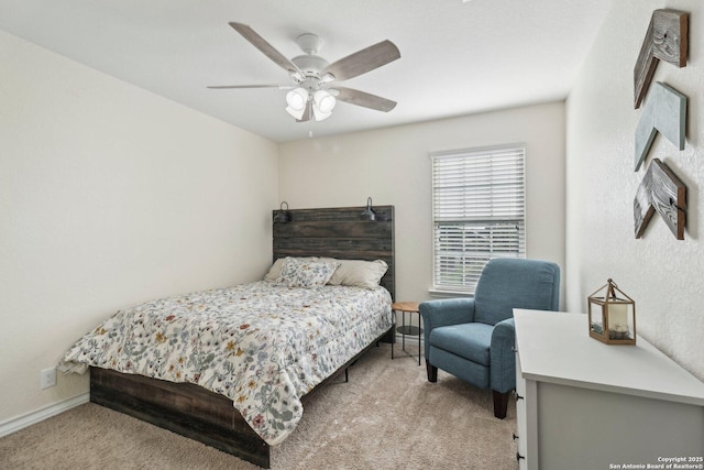 bedroom with carpet floors, baseboards, and a ceiling fan