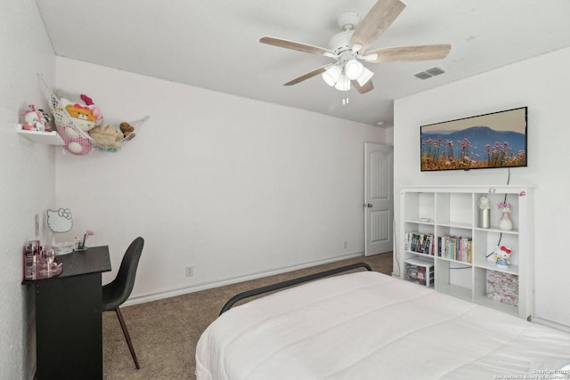 carpeted bedroom with visible vents, a ceiling fan, and baseboards