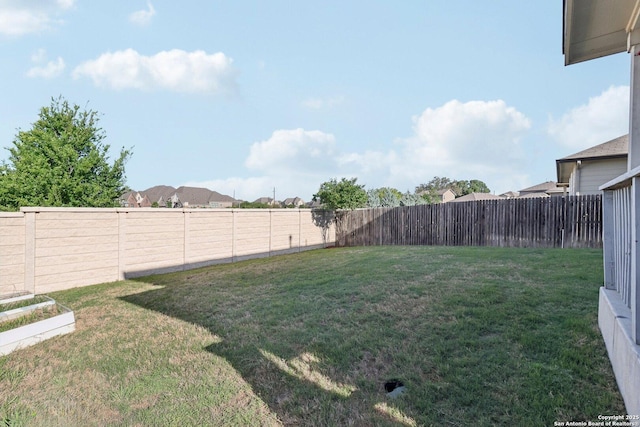 view of yard featuring a fenced backyard
