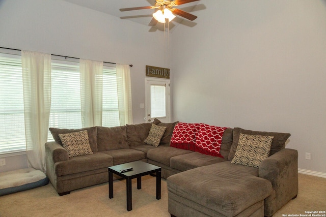 8220 Robin Gate, Selma, TX 78154 - living area featuring a towering ceiling, plenty of natural light, a ceiling fan, and light colored carpet