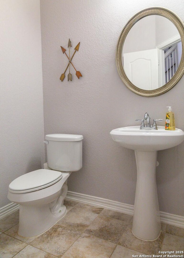 8220 Robin Gate, Selma, TX 78154 - half bathroom with baseboards and toilet