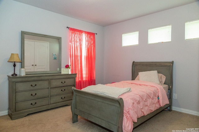 8220 Robin Gate, Selma, TX 78154 - bedroom with baseboards, multiple windows, and light carpet