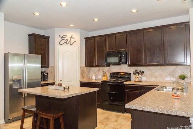8220 Robin Gate, Selma, TX 78154 - kitchen with light countertops, dark brown cabinetry, a sink, and black appliances