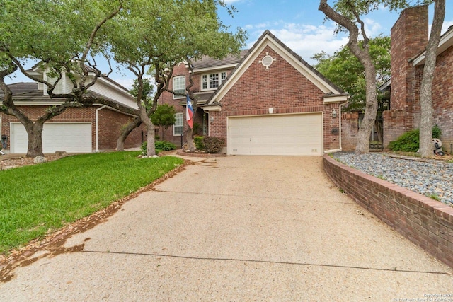 traditional home featuring a garage, a front yard, brick siding, a tiled roof, and concrete driveway